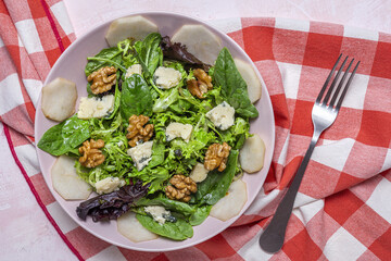 Homemade lettuce assortment salad with blue cheese, walnuts and pear