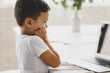 © Olena Bloshchynska - Little boy looking at laptop monitor.