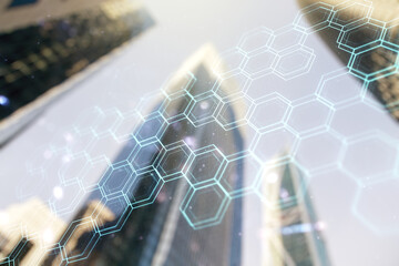 Wall Mural - Double exposure of abstract virtual technology hologram with hexagon on modern skyscrapers background. Research and development software concept