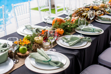 Formal Thanksgiving table and chavari chairs in the fall family group for holiday dinner