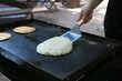 Making pancakes on outdoor griddle