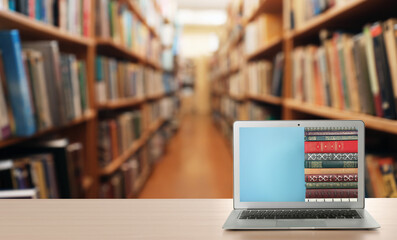 Poster - Digital library concept. Modern laptop on table indoors, space for text