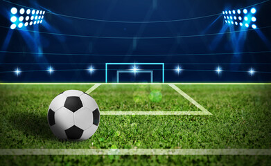 Soccer ball on green football field, space for text