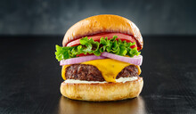 Thick Cheeseburger With American Cheese, Lettuce Tomato And Onion