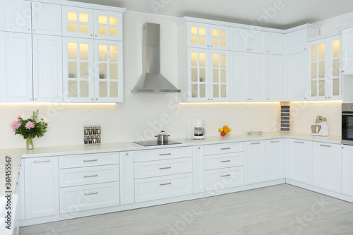 Fotomural Elegant interior of new kitchen with stylish furniture