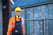© visoot - Electrician working with helmet and cable working on a construction site,Repair and handyman concept.