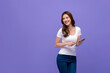 © Atstock Productions - Portrait of smiling beautiful woman with digital tablet looking at empty space aside on colorful purple background