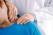 © Pcess609 - Doctor physiotherapist diagnosing patient with painful shoulder