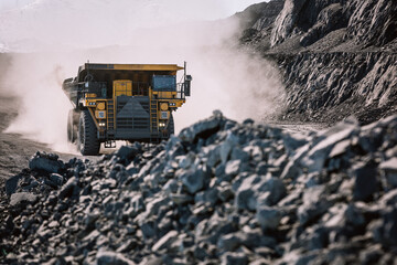 career dump truck is going to the gold mining range.