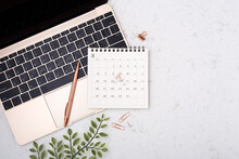 Calendar With Rose Gold Pen On Laptop