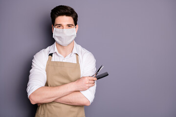 Sticker - Portrait of his he attractive guy skilled virile muscular barber wearing safety mask holding in hands scissors comb social distance mers cov preventive measures isolated grey color background