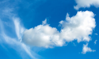 white fluffy clouds against a blue sky