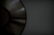 Black Vinyl Record with a Black Label on a Black Surface. Dark Music Background with Copy Space. 3D Render.
