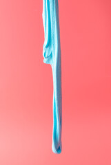 Blue slime isolated on pink background