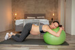 © Impact Photography - Pregnant woman relaxing and doing breathing exercises