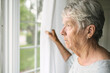 A worried senior woman at home felling very bad