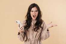 Image Of Angry Attractive Woman Screaming And Using Cellphone