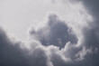 a background of gray atmospheric clouds and a cloud in the shape of a human figure standing waist high in the clouds and showing the class with his right hand