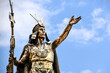 close-up of statue of Inca Pachacutec in Cusco, Peru against blue sky