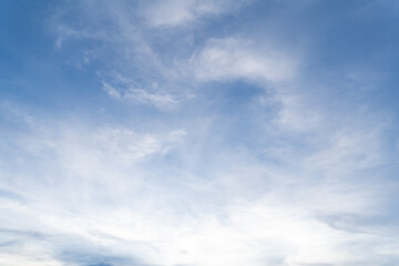 A group of clouds floating in the blue sky was blown to change shape in the summer