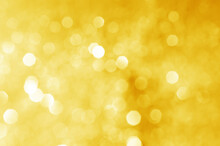 Abstract Defocused Yellow Bokeh Sparkling Light Glitter Background. For Wallpaper Backdrop And Template.