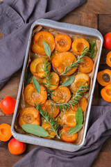 Baked apricots with honey, sage and rosemary leaves