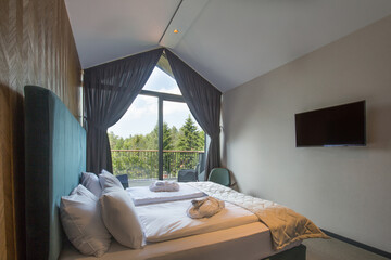 Wall Mural - Interior of a luxury hotel bedroom in mountain hotel resort