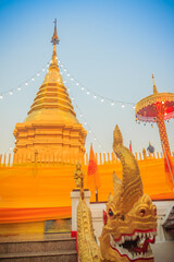 Beautiful golden pagoda at Wat Phra That Doi Kham. Chiang Mai, Thailand. Wat Phra That Doi Kham (Wat Doi Kham or the Golden temple) is located at the top of a hill to the south west of the city.