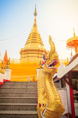 Beautiful golden pagoda at Wat Phra That Doi Kham. Chiang Mai, Thailand. Wat Phra That Doi Kham (Wat Doi Kham or the Golden temple) is located at the top of a hill to the south west of the city.