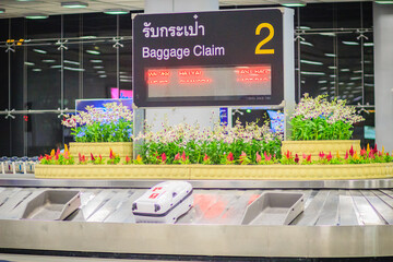 Traveler claims their baggage on the conveyer at the Suvarnabhumi international airport.