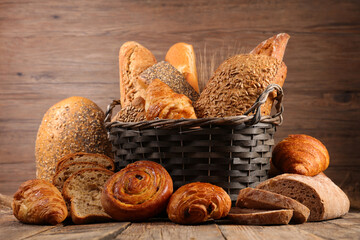 Wall Mural - assorted traditional french bread and croissant on wood background