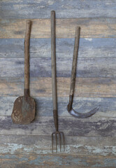 Sticker - agricultural tools on old wooden background