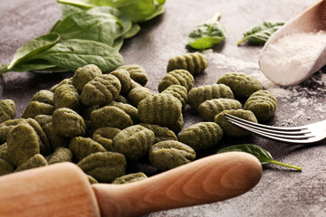 Wall Mural - hand made gnocchi with fresh Spinach. italian traditional gnocchi on background