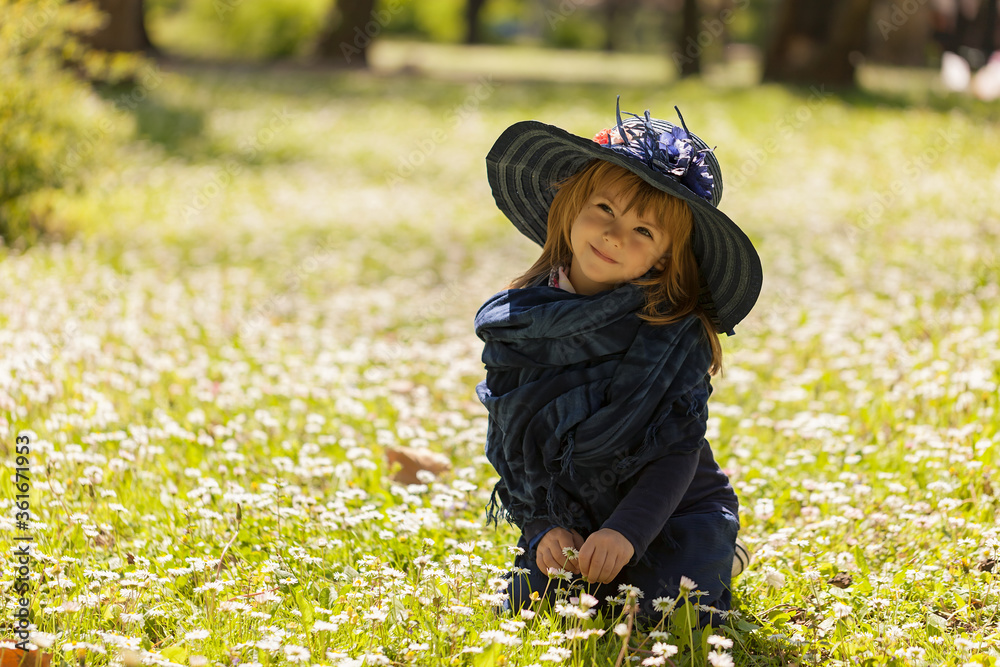 little girl in a flower field Stock Photo | Adobe Stock