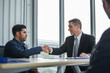 © eakgrungenerd - Business people shaking hands connection and partnership successful, Business concept.