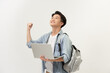 © makistock - Winning asian college student with laptop in his hand isolated on white background