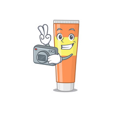 Sticker - a proficient photographer toothpaste cartoon design concept working with camera