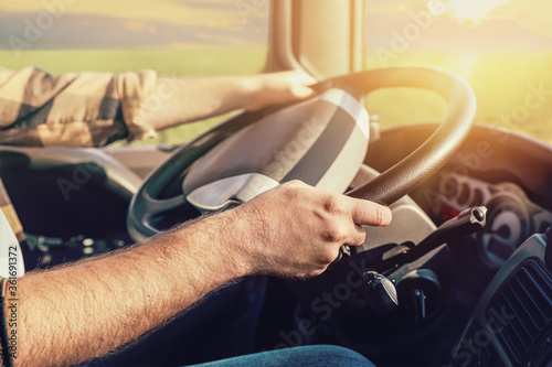 Fotografía Young man driving modern truck, closeup