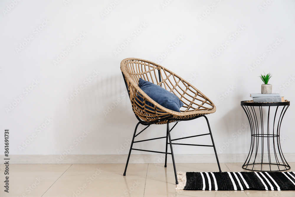 Stylish interior of room with armchair and table