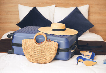 Packed suitcase on bed. Travel concept