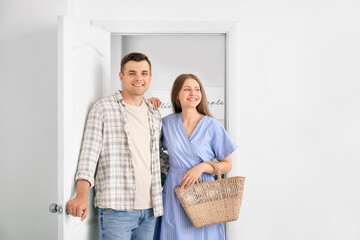 Canvas Print - Happy couple opening door at their new home