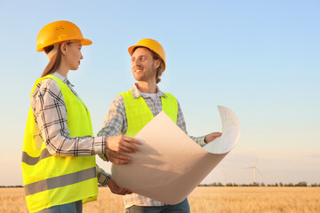 Wall Mural - Engineers on windmill farm for electric power production