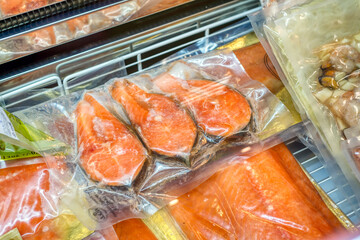 Frozen red fish lies in a shop window.