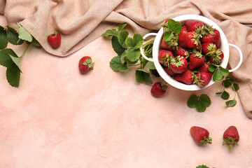 Colander with fresh ripe strawberry on color background