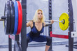 © zyabich - Athletic young woman doing exercises with barbell at the gym, fitness club. Health, bodybuilding, training, wellness, lifestyle, sport and workout concept