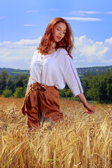 Wall Mural - girl in a wheat field