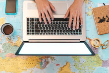 Top View Female Hands Using Laptop On World Map Booking Next Travel Destinations - Young Trip Agent Woman Browsing Online - Future Traveling And Technology Concept