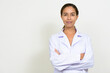 © Ranta Images - Portrait of beautiful multi ethnic woman doctor with arms crossed