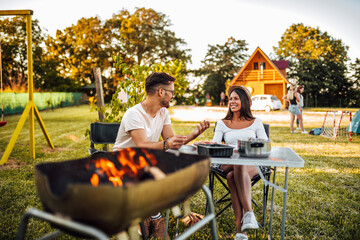 Friends relaxing on a camping trip in Europe.