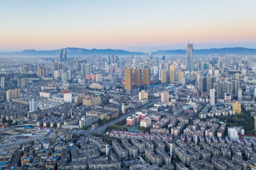 Fototapete - aerial view of kunming city scene in sunrise